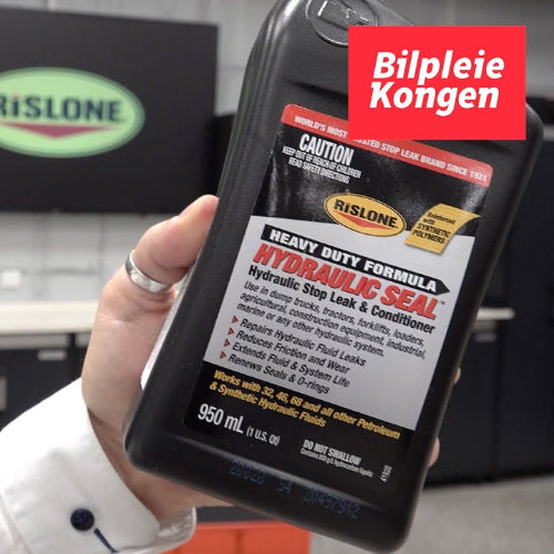 Rislone Heavy Duty Hydraulic Seal in hand in a workshop
