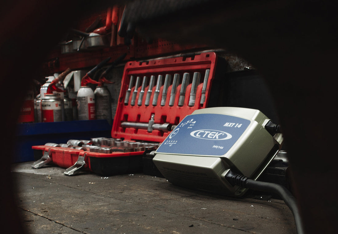 CTEK MXT 14 24V battery charger in a workshop in india along with a tools box
