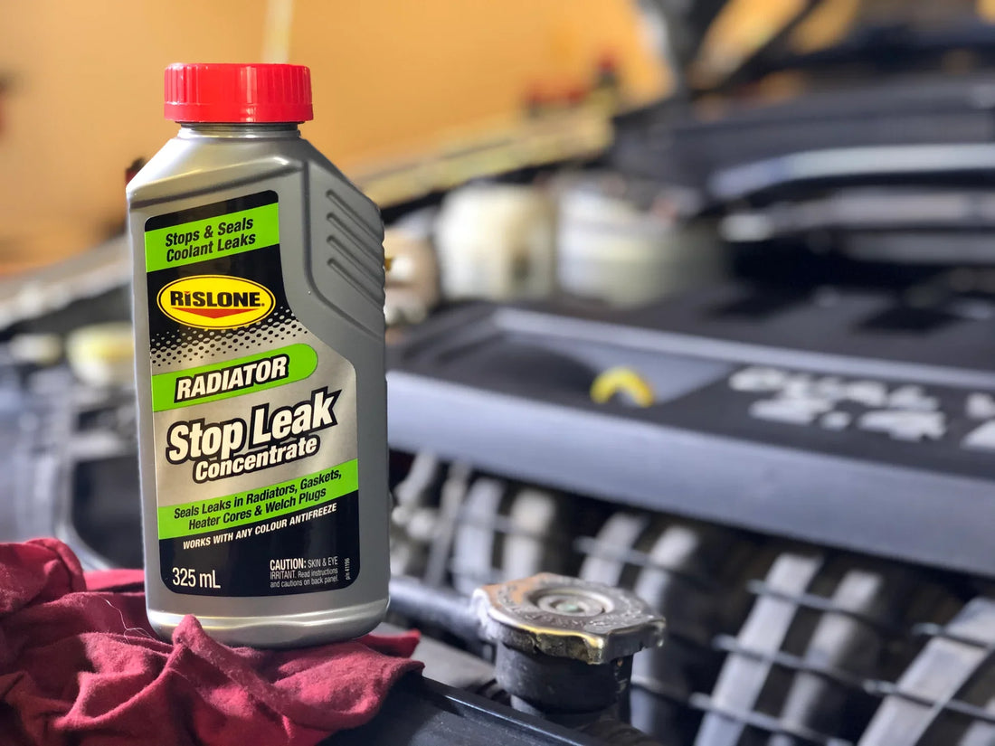 Rislone Stop leak concenrate on a car engine with the raditor cap visible