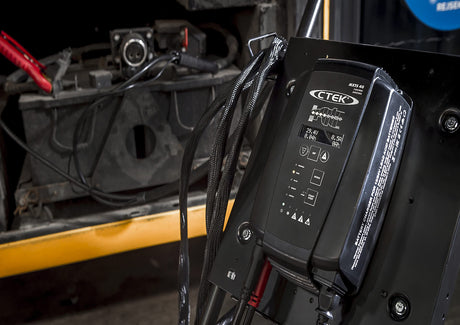 Black ctek mxs 40 battery charger with digital display and control buttons used for battery charger and support unit comparison