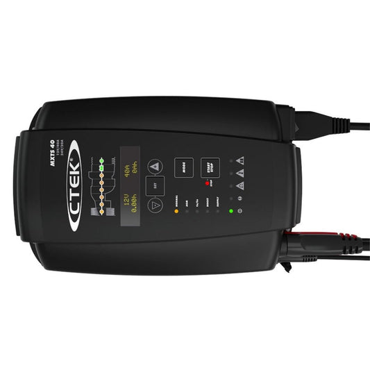 CTEK MXTS 40 professional 12V/24V 40-amp battery charger with clamps and display panel on workshop bench