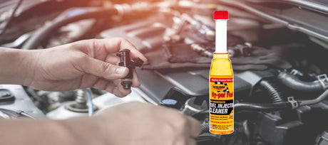 Yellow bottle of hi-per fuel injector cleaner with red cap and black label for resolving clogged injectors.