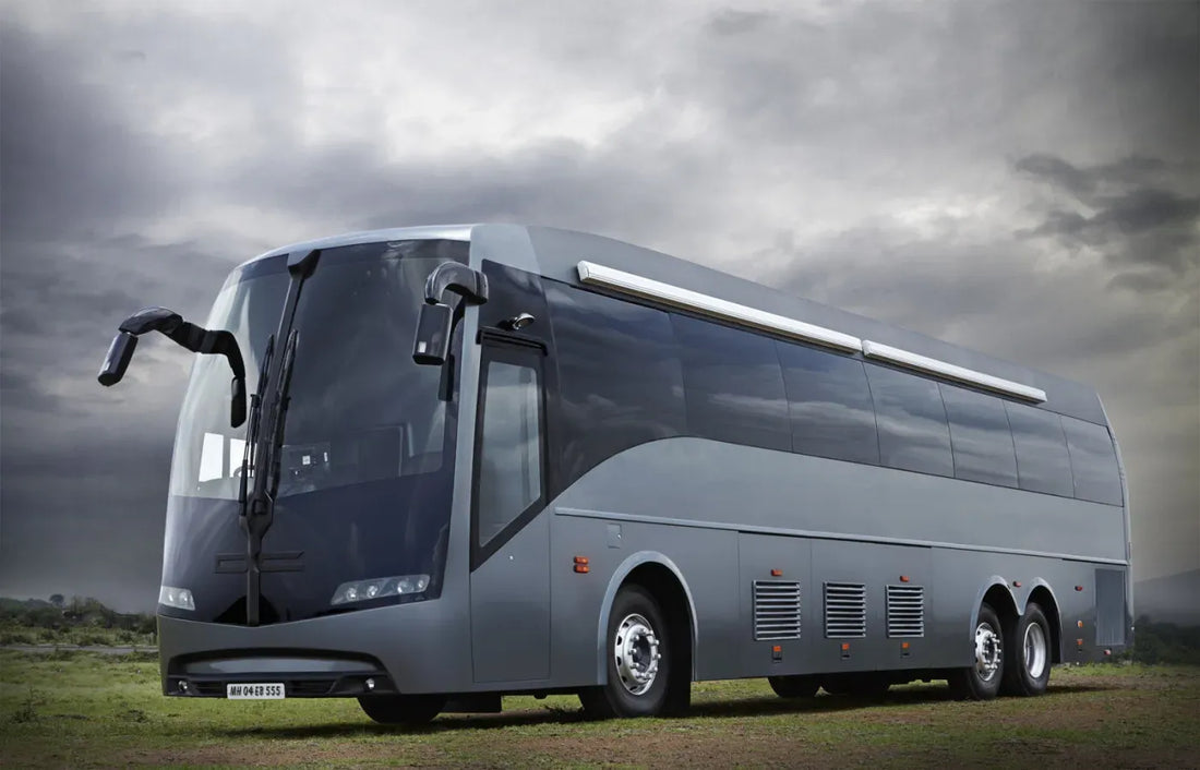 Gray luxury coach bus with sleek modern design and tinted windows illustrating benefits of dual battery systems for rv