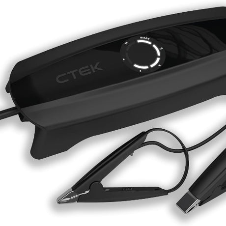CTEK CS One 12V AGM charger shown beside a coin for compact size reference, ideal for Indian vehicles
