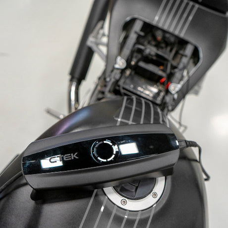 CTEK CS One 12V AGM charger in use at an Indian home garage, ideal smart battery charger for cars and bikes