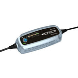 CTEK Lithium XS 12V LiFePO4 charger maintaining a motorcycle battery in an Indian garage setting