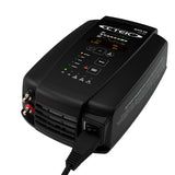 CTEK MXTS 40 40 amp battery charger in use, powering a vehicle battery in an Indian garage setting