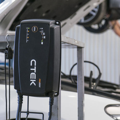 Black ctek pro 20se electric vehicle charging station with illuminated indicator lights for workshop fleet charging in India