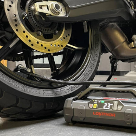 Lokithor JA300 car jump start kit shown beside a smartphone for size reference, compact enough for Indian glove boxes