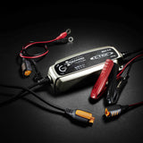 Silver and black CTEK MXS 5.0 smart 12V battery charger with red and black clamps and digital display for cars and superbikes