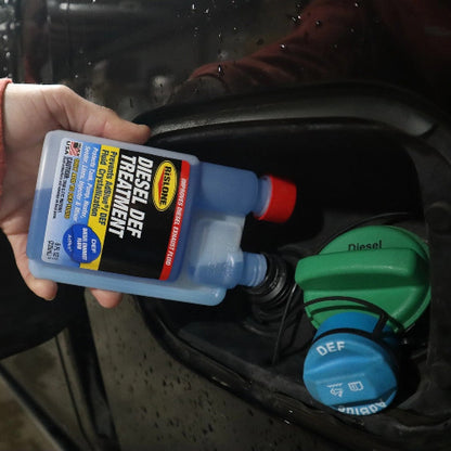 Blue plastic bottle of rislone diesel def treatment with red cap and yellow label prevents adblue crystallization