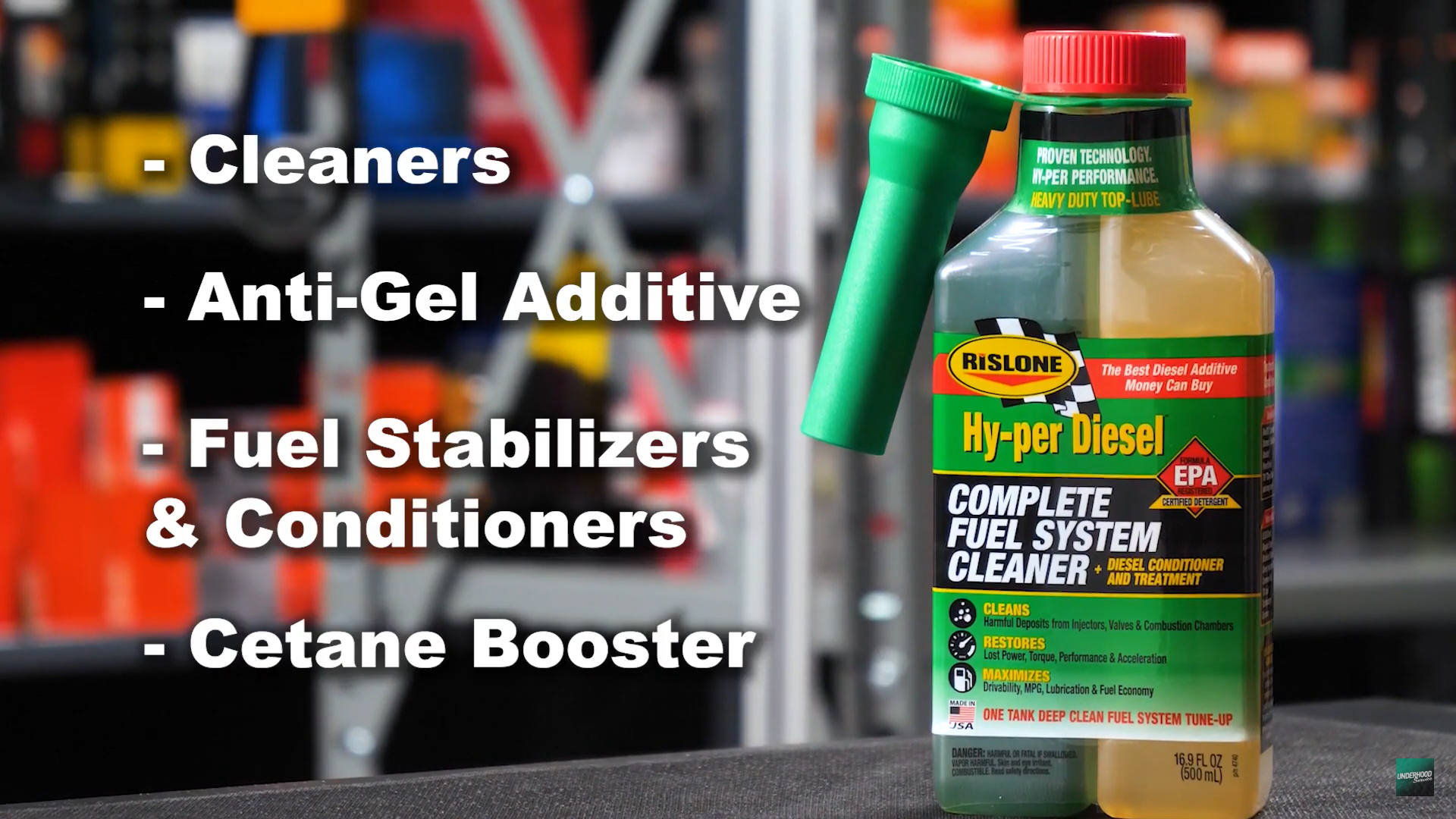 Fuel system cleaner bottle with product features listed on a blurred background