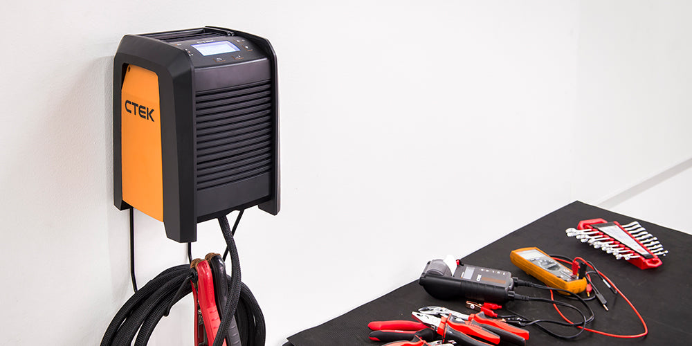 Ctek pro 60 black and orange wall-mounted 12v 60a battery charger with digital display for lead-acid and lifepo4 batteries