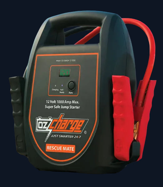 Black plastic ozcharge rescue mate 12 volt heavy-duty jump starter with red jumper cables and digital display