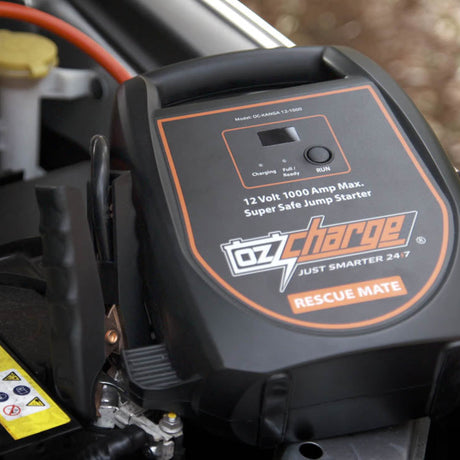 OzCharge RM 1000 supercapacitor jump starter in use on a car bonnet, ideal 1000A roadside rescue across India